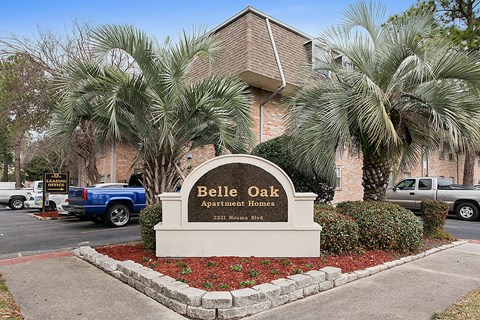 a apartment homes sign in front of a building